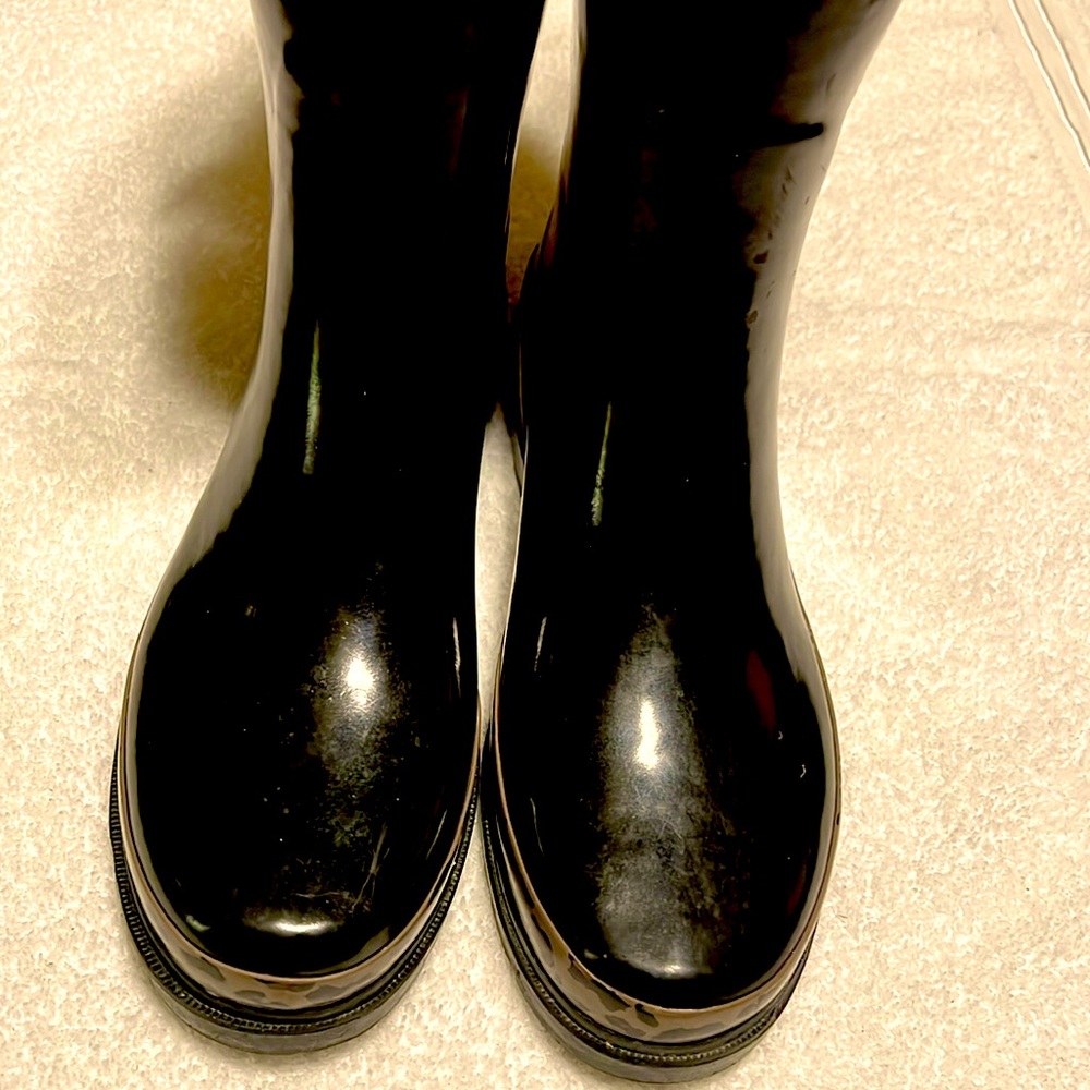 Size 6. Black and animal print rain boots